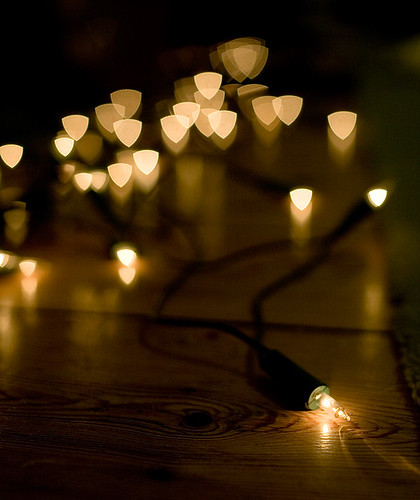An example of the Bokeh effect with a triangular aperture, image shows fairy lights out-of-focus